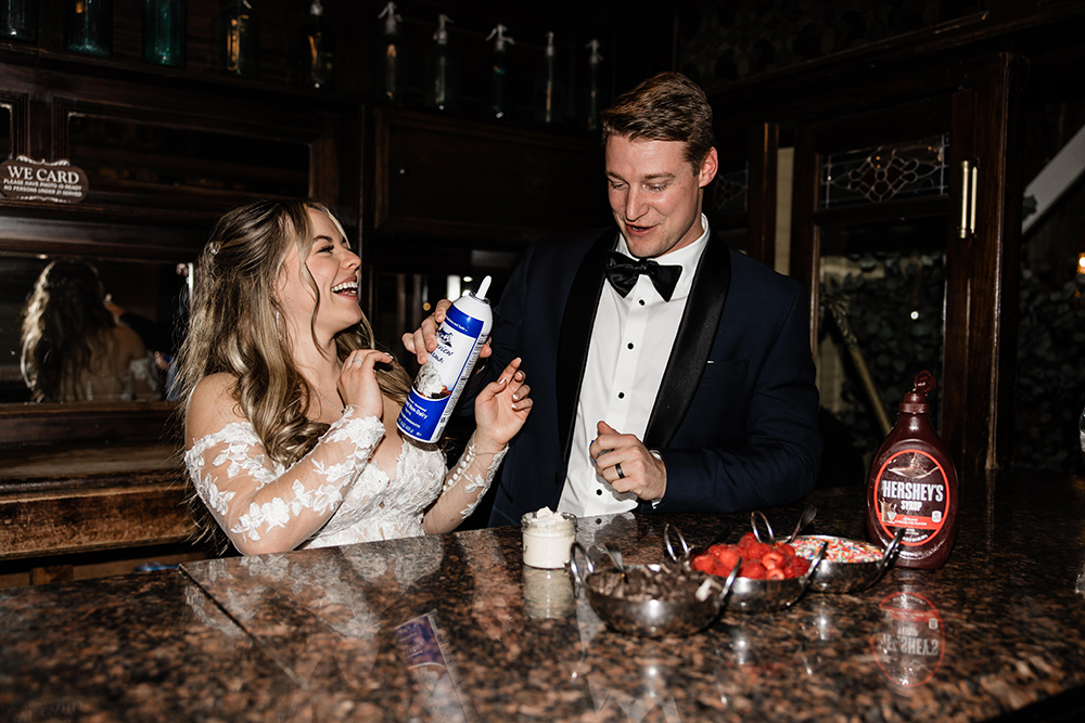 bride and groom with sweet treats