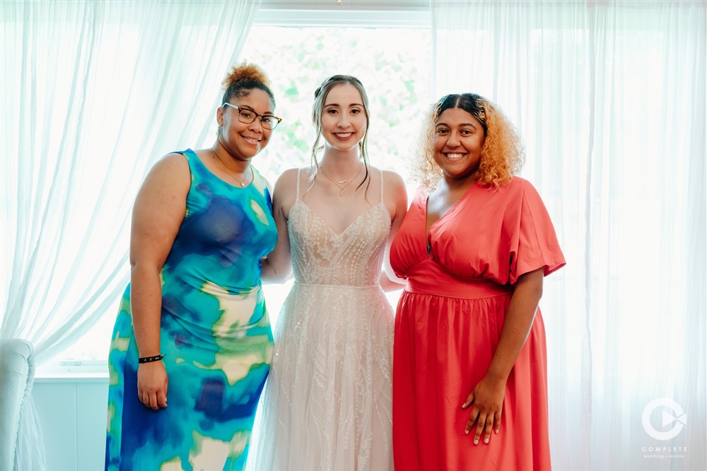 bride with personal attendants