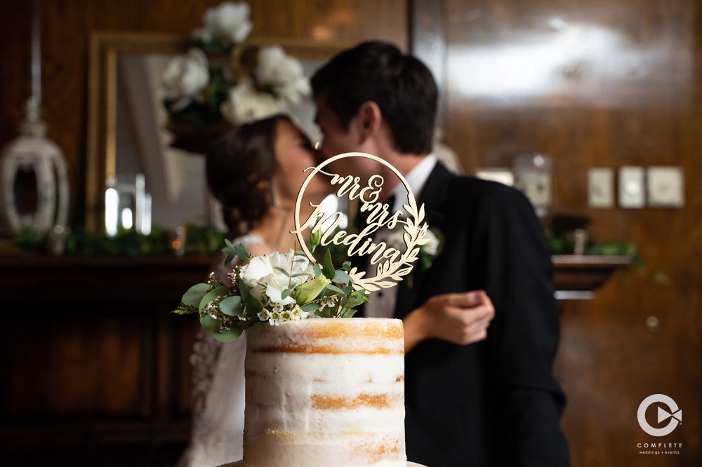 Popular 2020 Wedding Features to Stay in 2021 Bride and Groom with cake