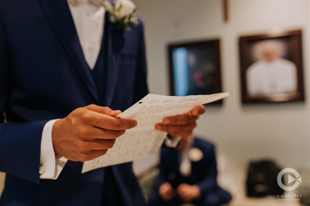 Getting Ready with Groom reading letter