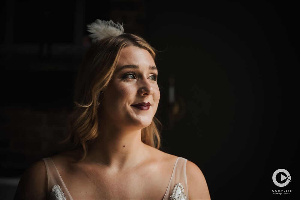 a bride getting ready for her 1920's theme wedding