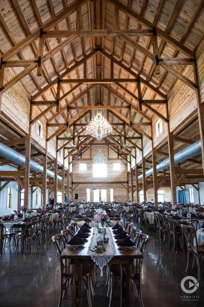 purple wedding barn reception chandeliers