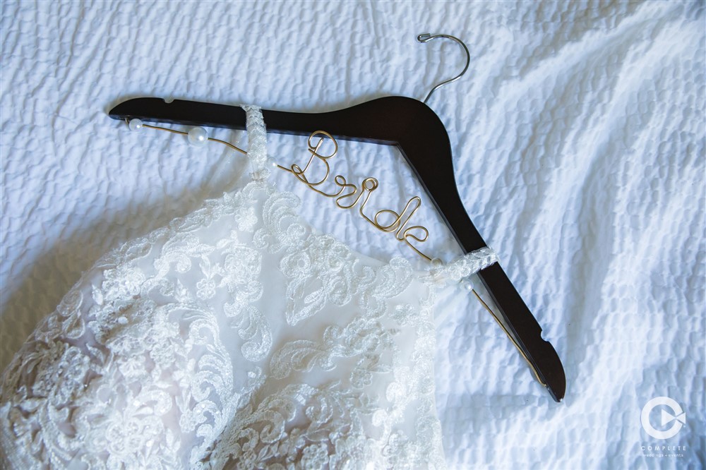 Biggest Wedding Day Regrets Couples Have Wedding dress detail shot at a winter wedding in Minnesota