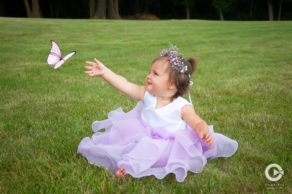 Baby catching butterfly