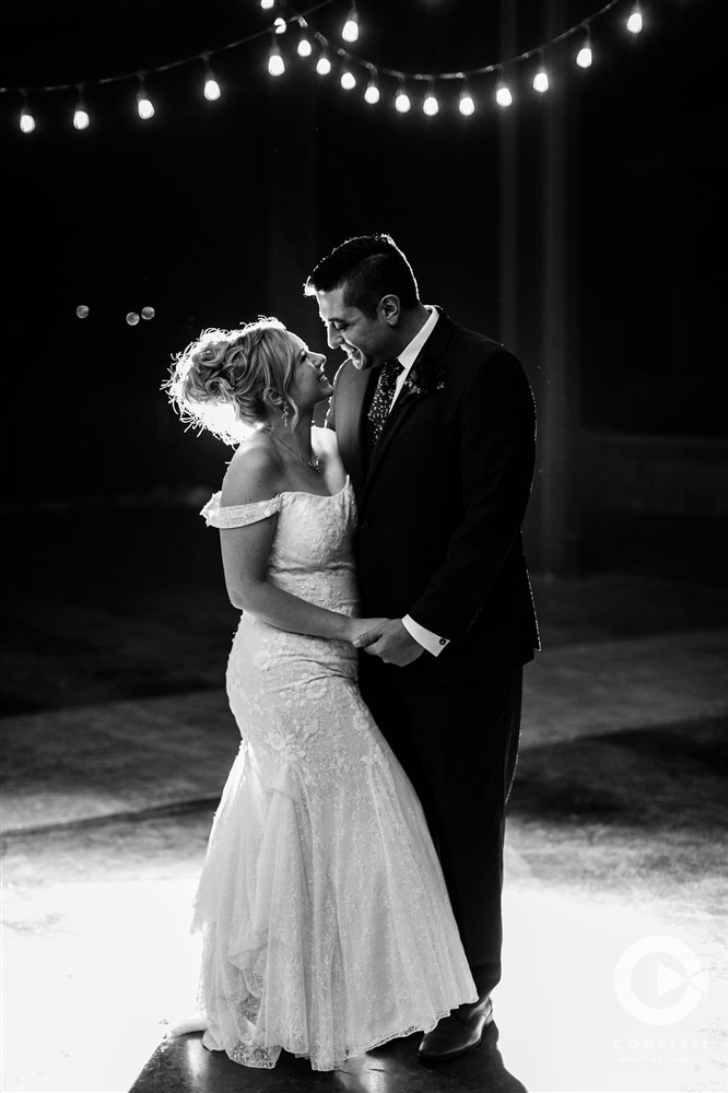 Bride and groom first dance during wedding reception in Brainerd black and white photo