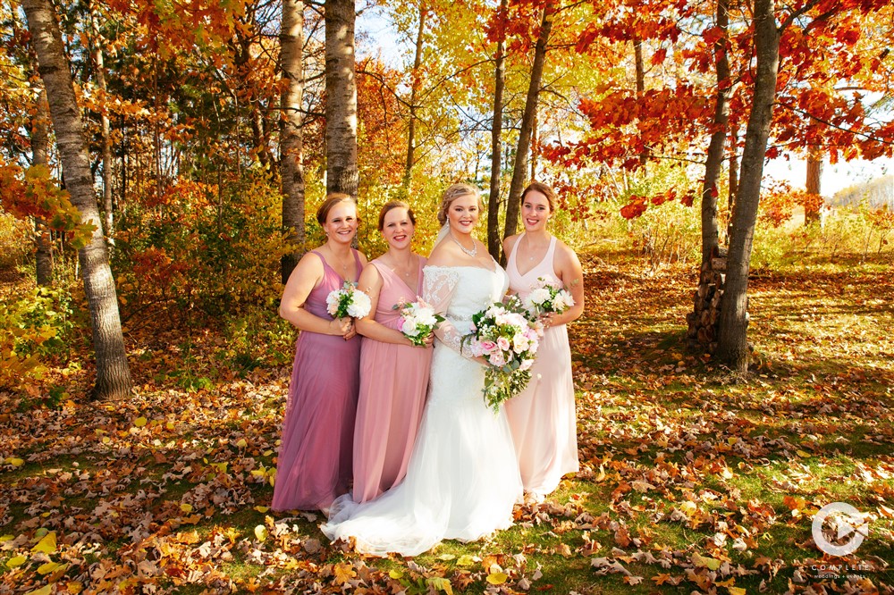 Bride and bridesmaids wearing pink in fall wedding