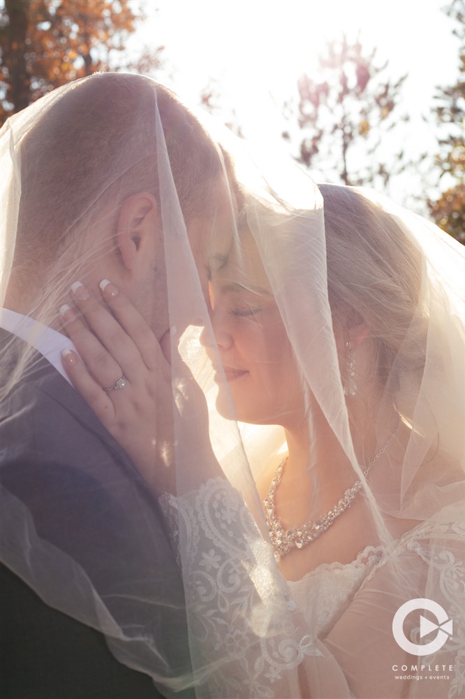 Couple wedding portrait with veil