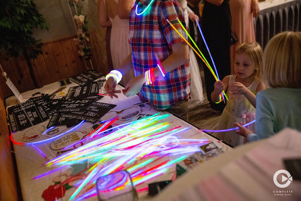 Kids at wedding playing with glow sticks