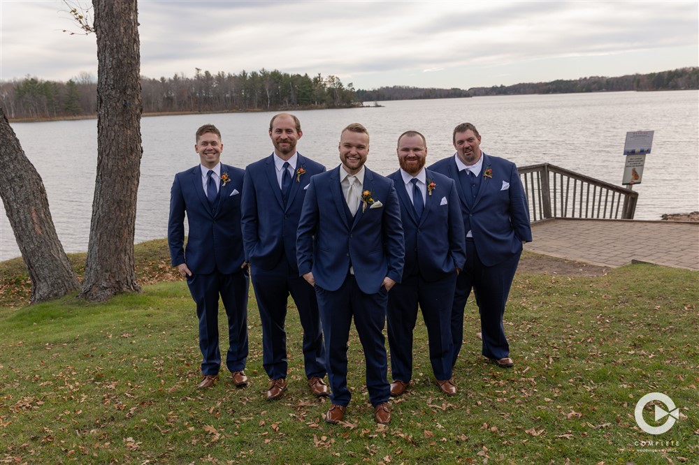 groomsmen in navy blue suit