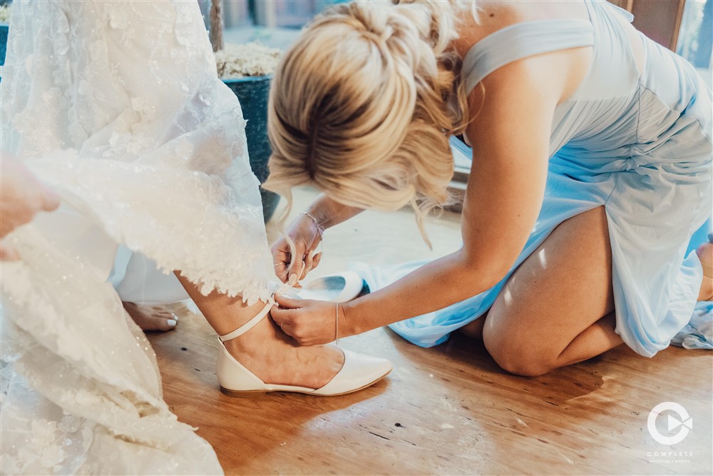 Putting on brides shoes