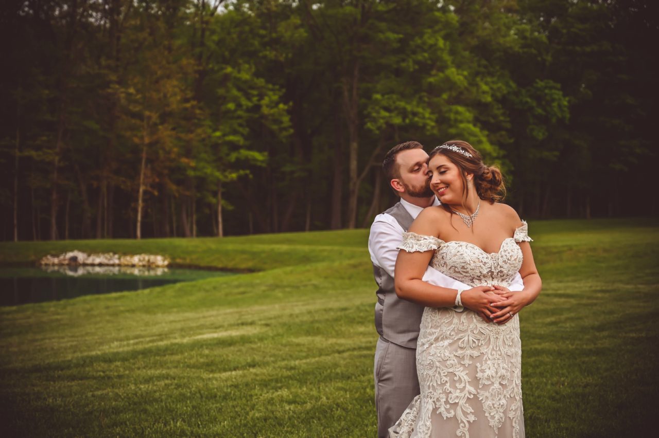 Complete Weddings + Events, Bride, Groom, Groom kissing Bride