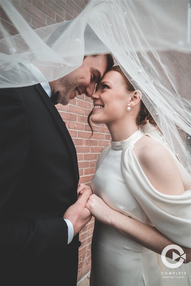 Complete Weddings + Events Photography, Bride and Groom portraits, Veil, bride and groom smiling and holding hands