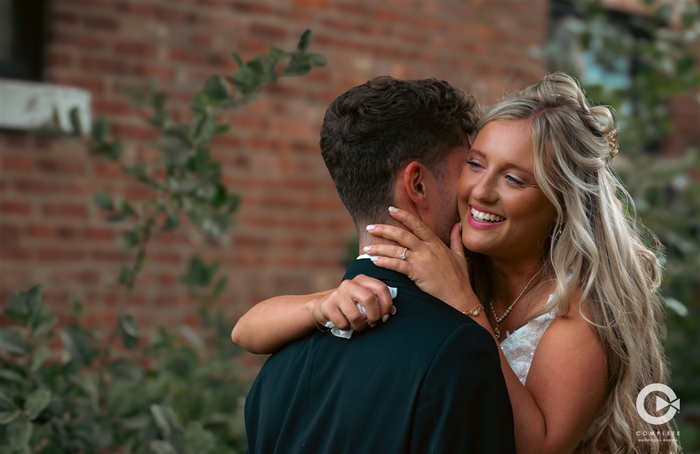 Complete + Weddings Events Photography, Wedding portraits, Bride and Groom hugging. first look photo