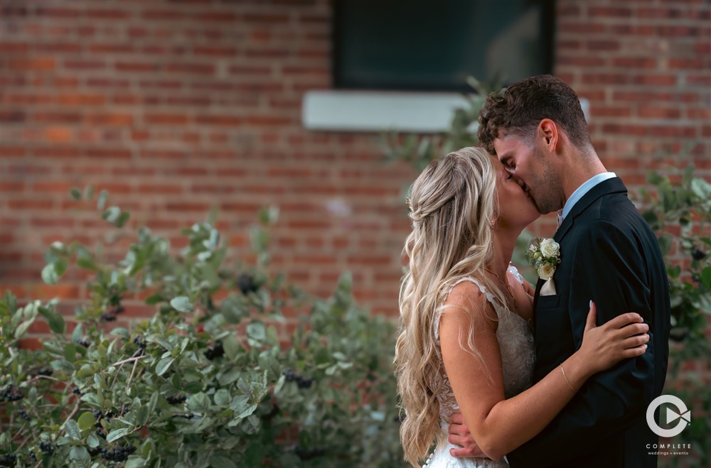 Complete + Weddings Events Photography, Wedding portraits, Bride and Groom kissing