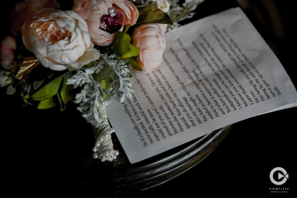 Detail shot of flowers and vows