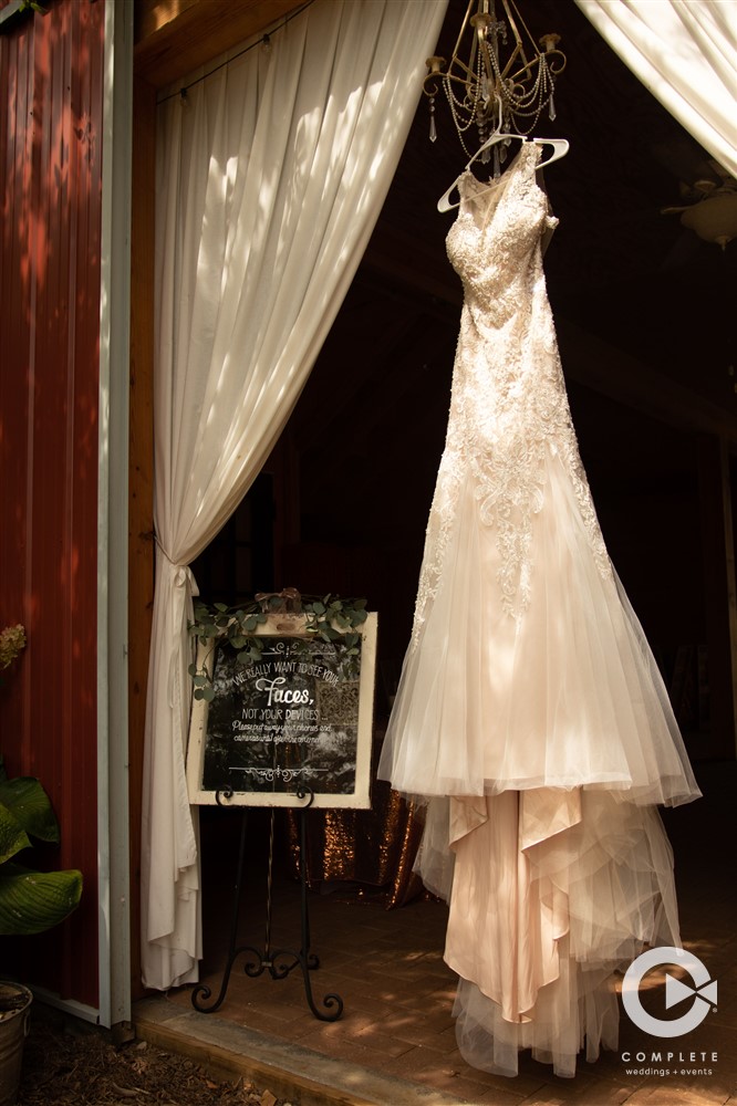 Illinois wedding dress hanging on barn