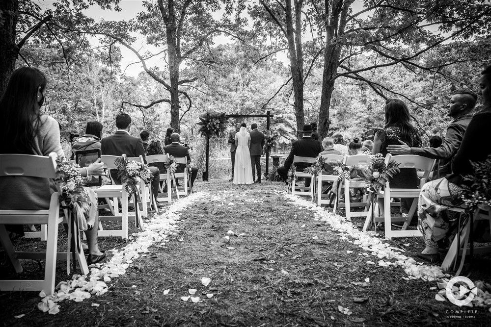 Outdoor wedding ceremony in Peoria Illinois under trees