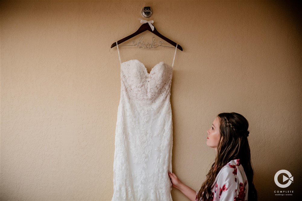 Bride looking up at Decauter Conference Center wedding dress