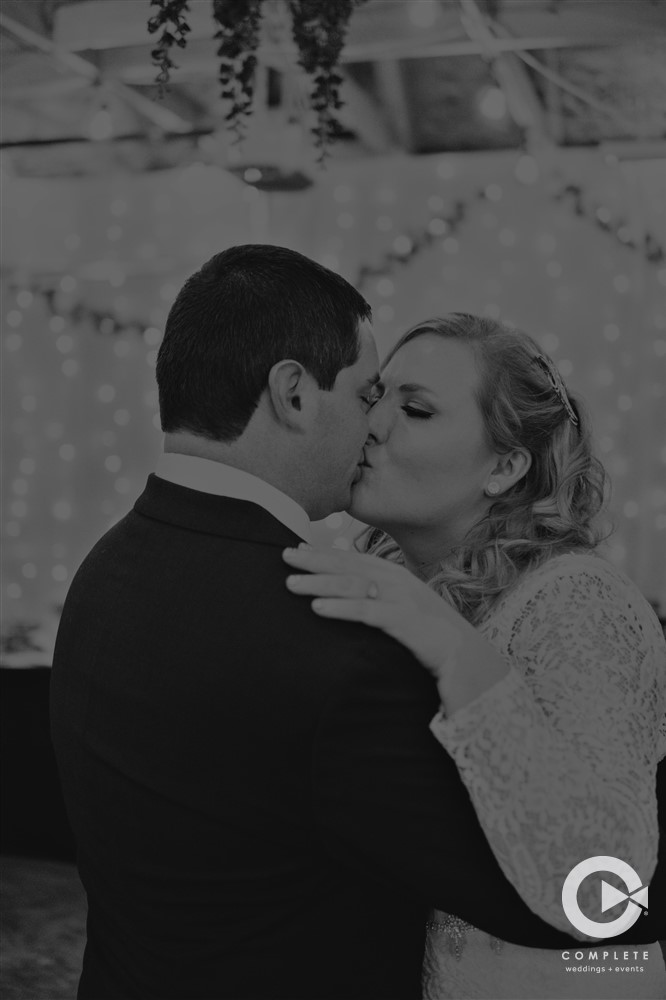 Couple Kissing after Ceremony