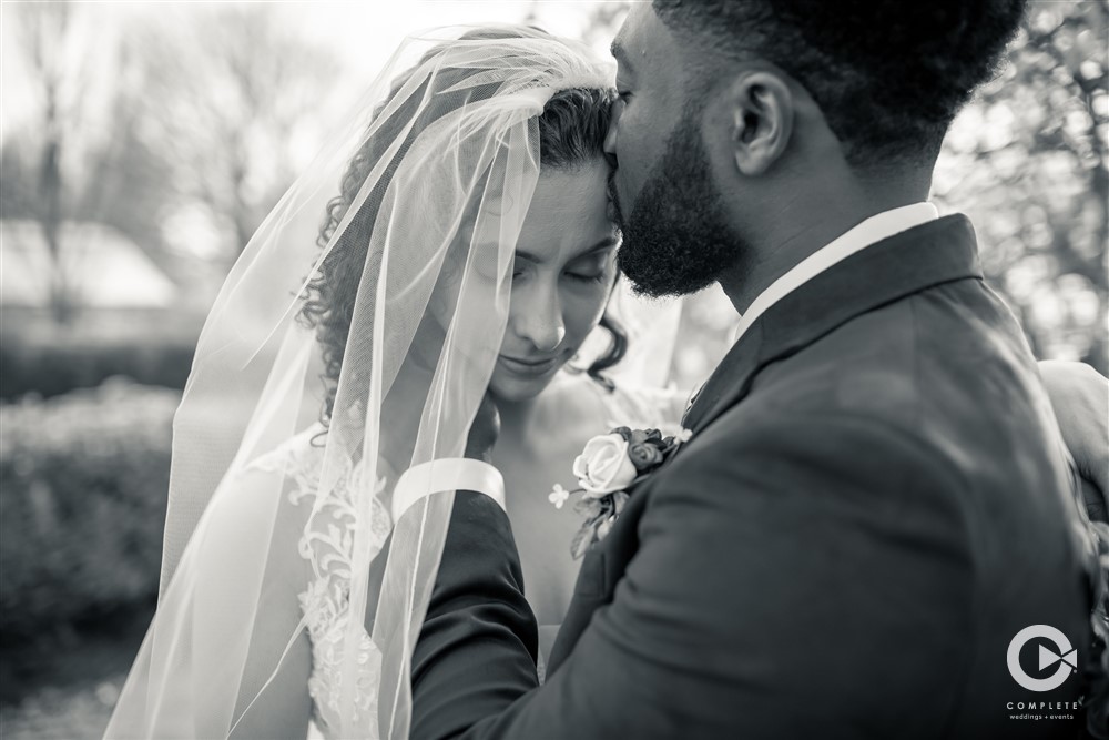 veil on, close up photo of couple