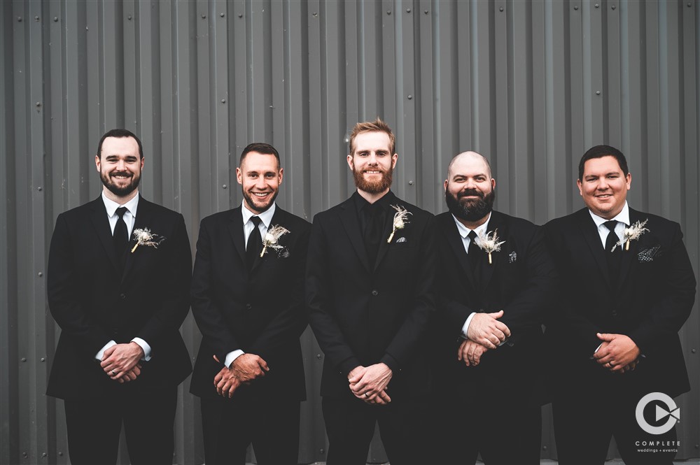 Breanna + Alex groomsmen wearing black suits