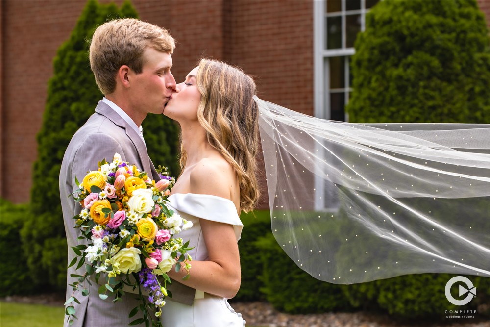 Complete Weddings + Events Photography, Wedding Portraits, Bride and Groom kissing