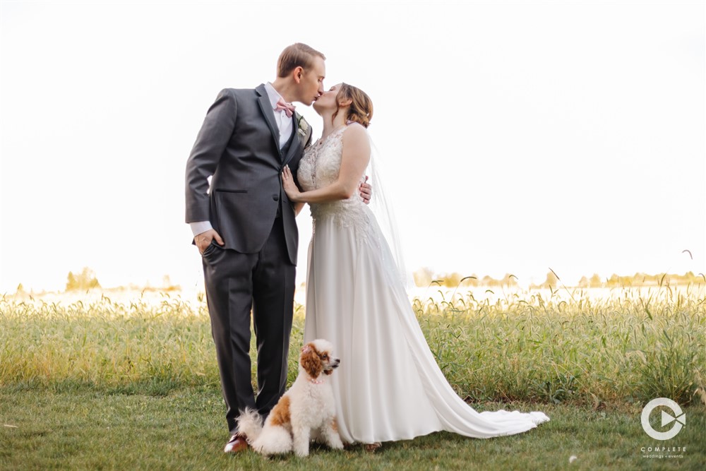 Groom and bride photo with dog