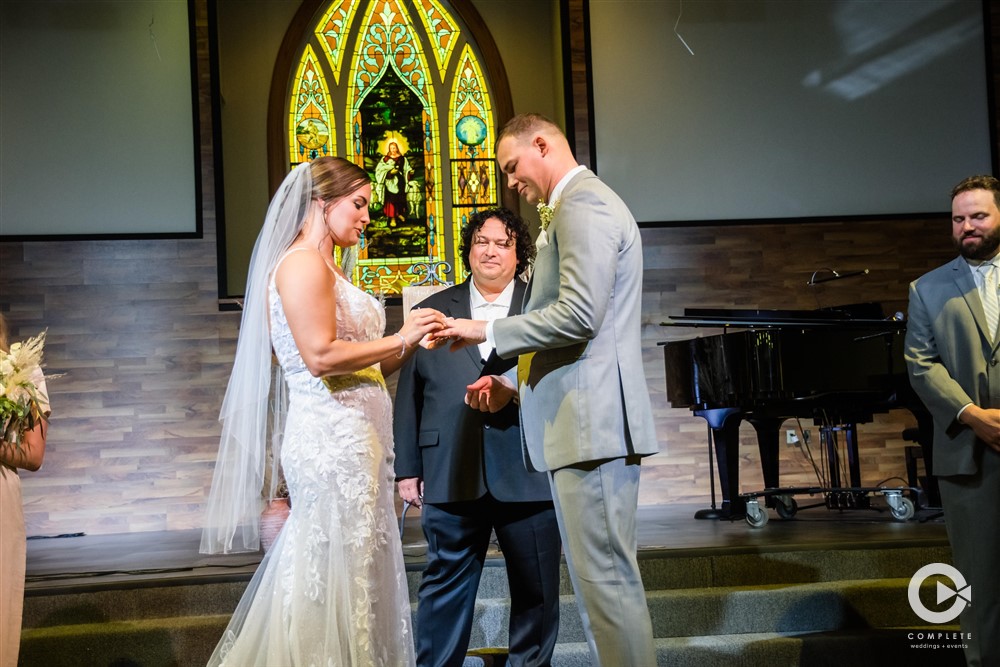 Bride and groom exchanging rings