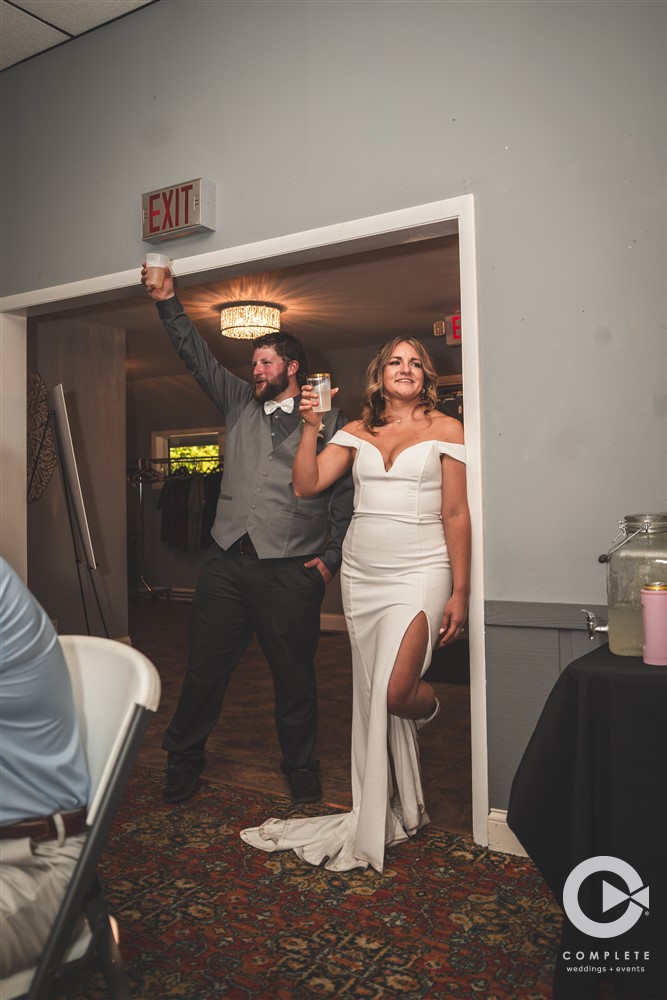 Complete Weddings + Events Photography, bride and groom toasting