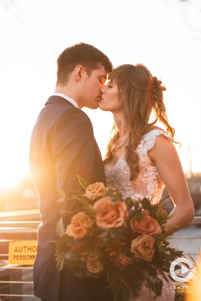 Complete Weddings + Events Photography, wedding portraits, bride and groom kissing at golden hour