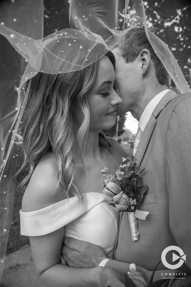 Complete Weddings + Events Photography, Wedding portraits, wedding photos, bride and groom kissing, veil photo