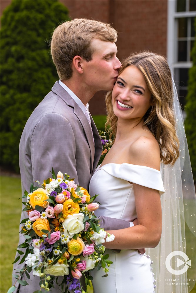 Complete Weddings + Events Photography, Wedding portraits, wedding photos, groom kissing the bride