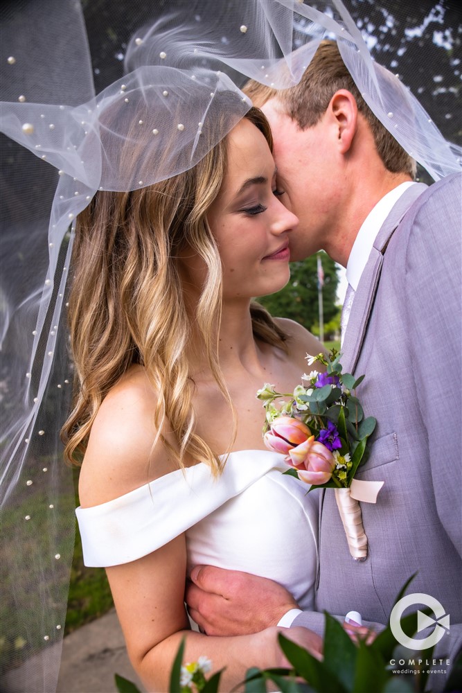 Complete Weddings + Events Photography, Wedding portraits, wedding photos, bride and groom kissing, veil photo