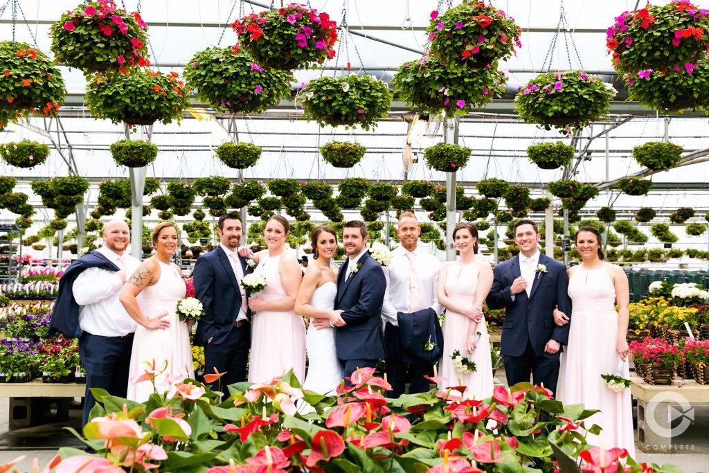 captures the essence of spring with bright colored flowers and wedding party.