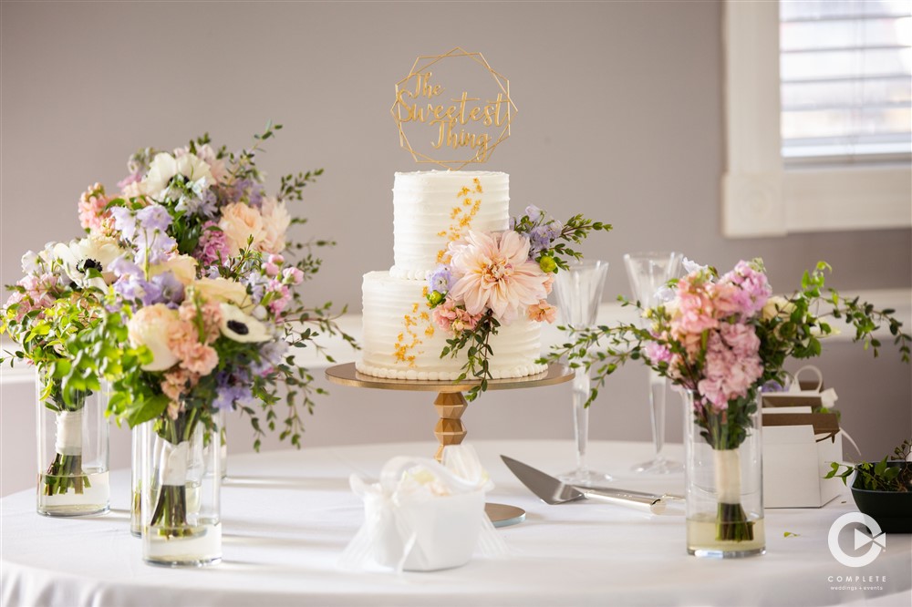 Bright floral arrangements with cake