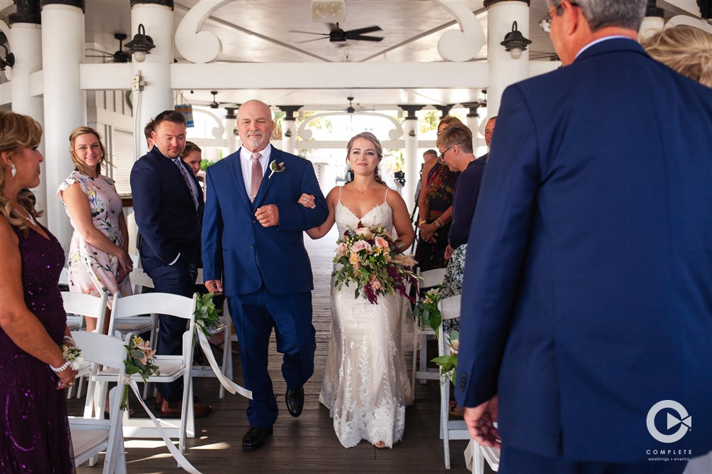 bride and father walks down aisle
