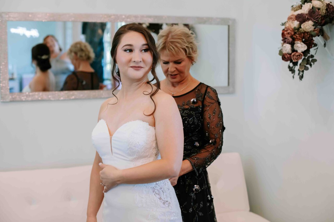 Bride with her mother getting ready for wedding at Dunes West Golf Course & River Club