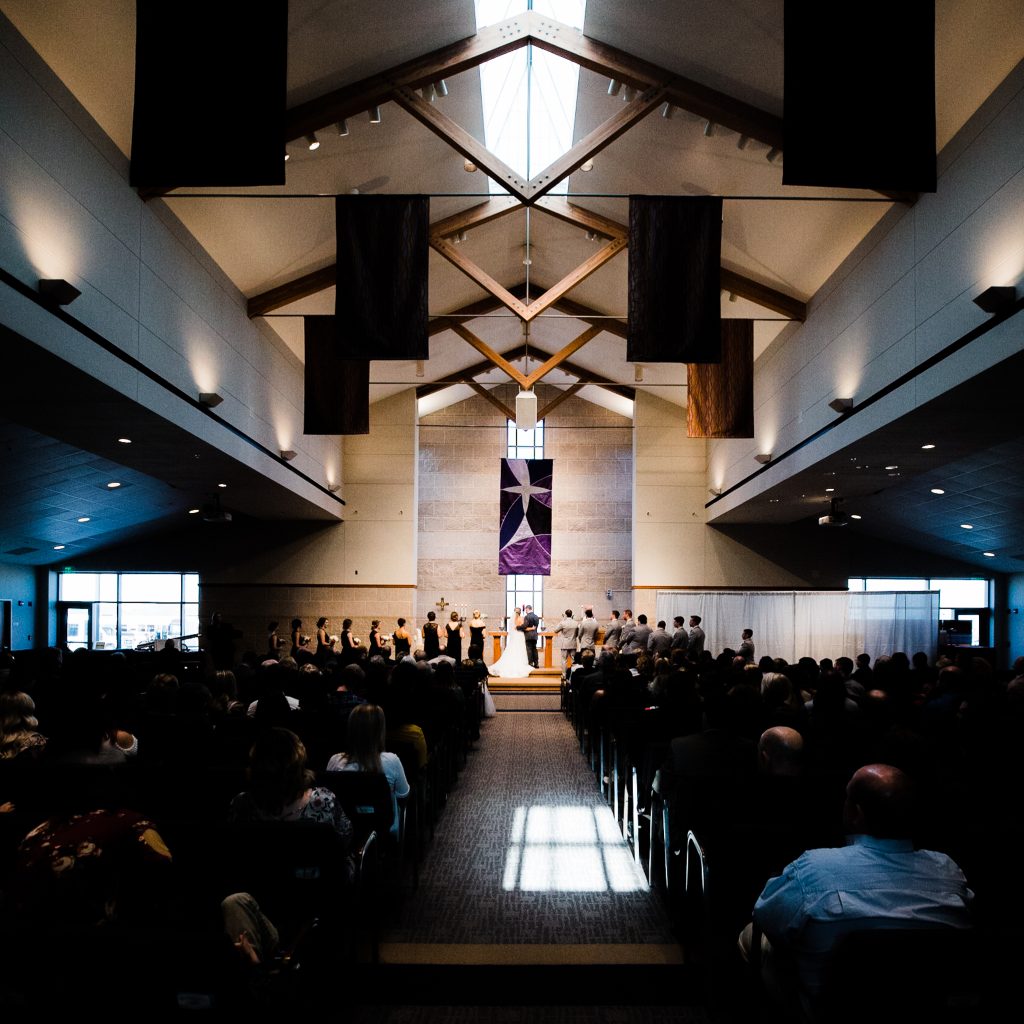 an image of a ceremony from the back of the wedding venue
