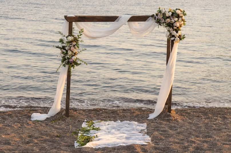 wooden wedding arch with lake view