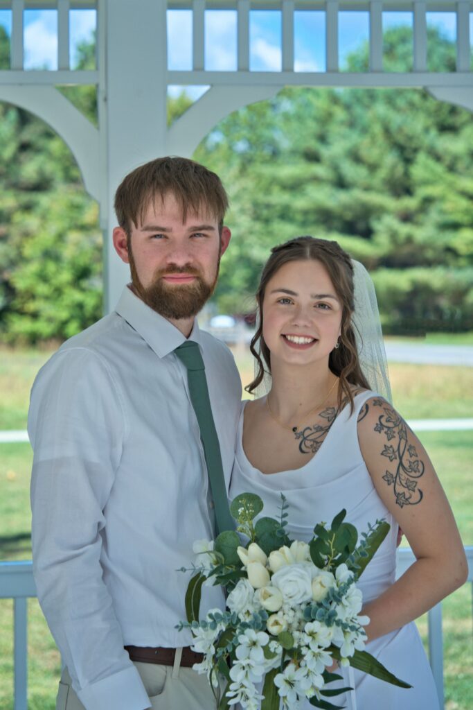 Bride and Groom pose looking into the camera in Middletown, Ohio. The owner of Complete Weddings and Evens Cincinnati is Michael Evans and he is the photographer for this photo.