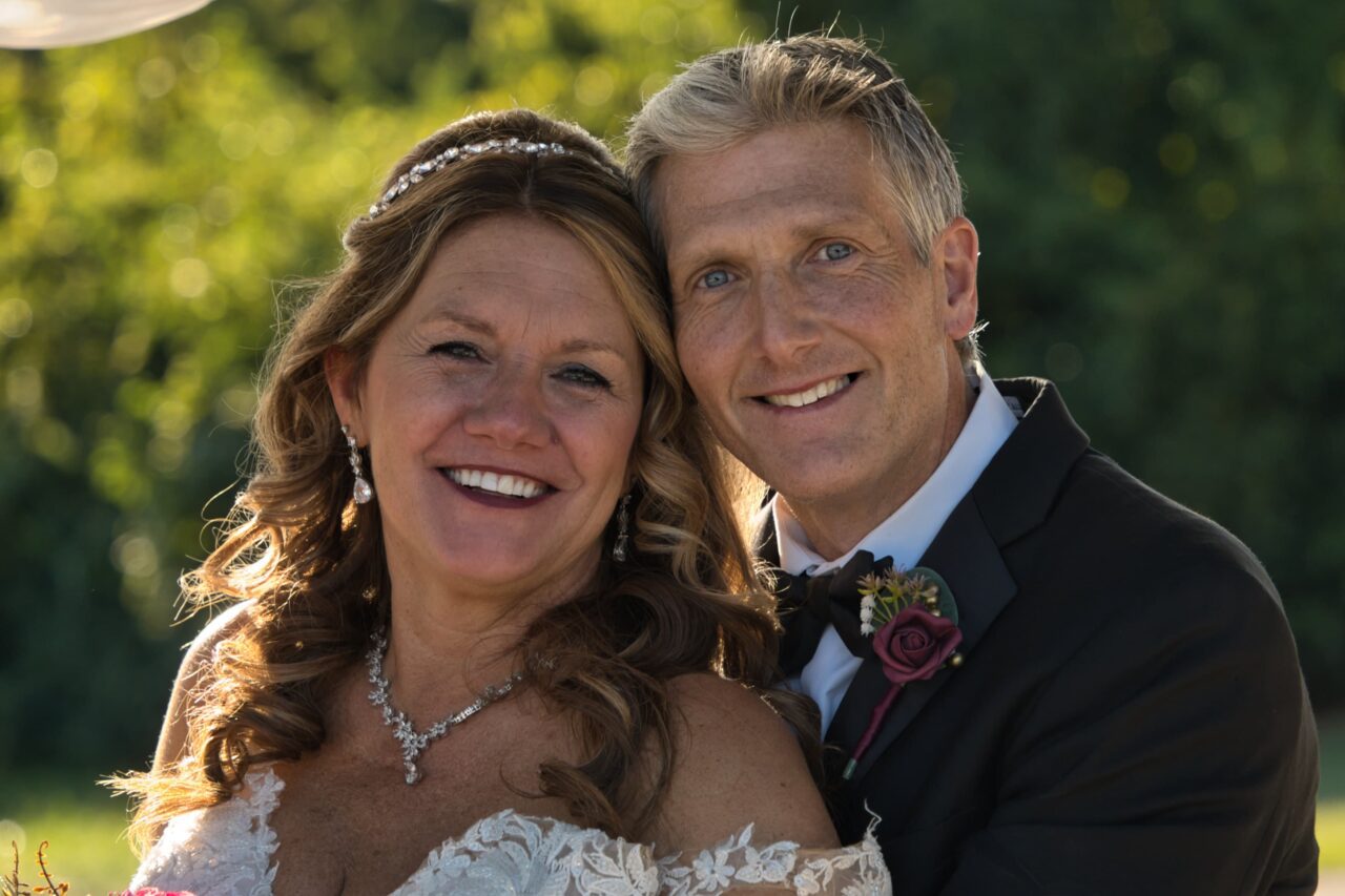 Bride and Groom holding one another looking into the camera in Sharonville, just outside of Cincinnati. Michael Evans is the photographer working at Complete Weddings + Events Cincinnati.