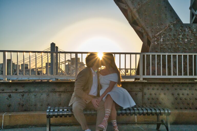 Bride and Groom share a kiss on the bridge in Cincinnati, Ohio. Michael Evans of Complete Weddings and Events took the photo.