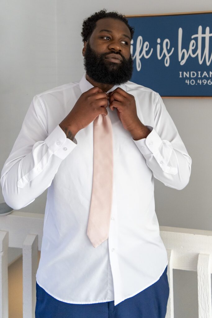 Groom getting ready for the Big Day. Complete Weddings and Events photographer Michael Evans took this photo.