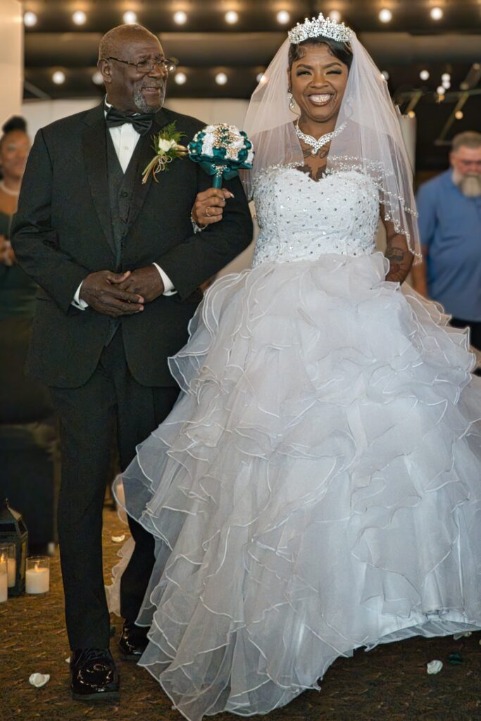 Father walks his Daughter and Bride down the aisle. Photographer credit goes to Michael Evans of Complete Weddings and Events Cincinnati.