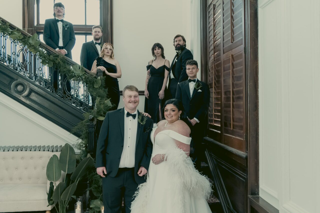 Wedding Party poses on stairwell. Michael Evans is the photographer from Complete Weddings and Events Cincinnati.