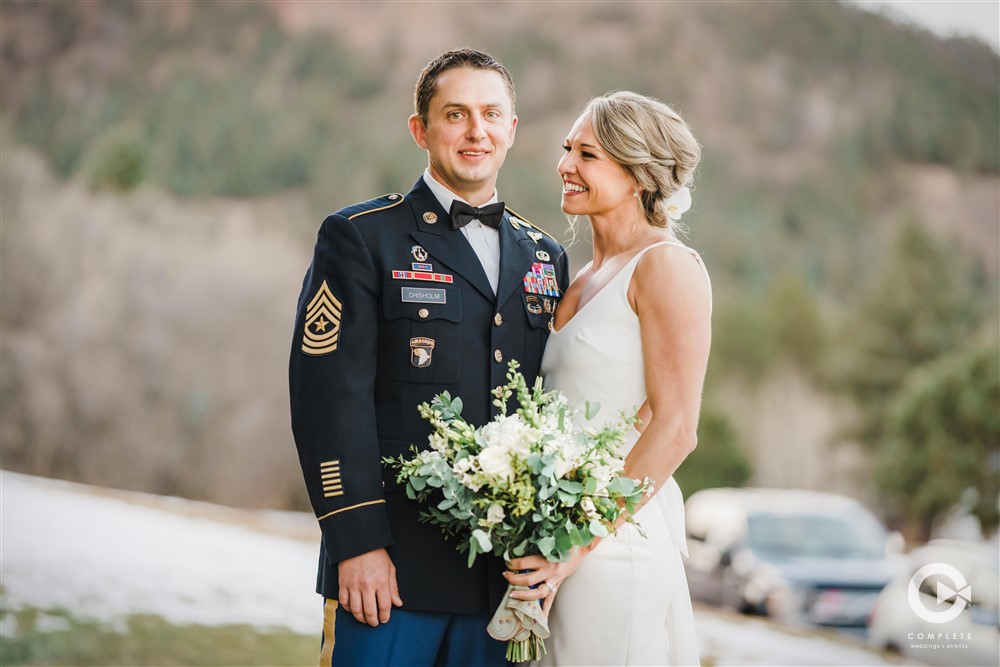 bride and groom mountain background
