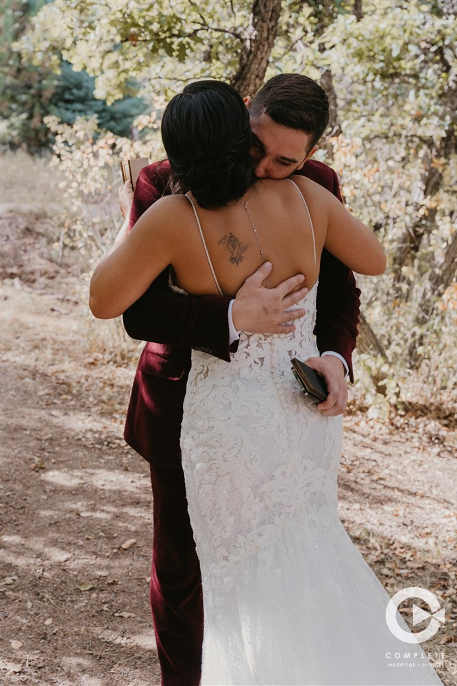bride and groom hugging