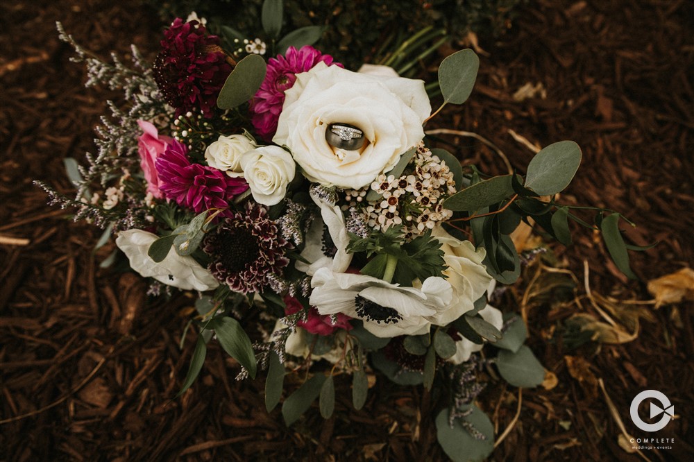 Wedding detail shot taken near Colorado Springs Colorado flowers with rings