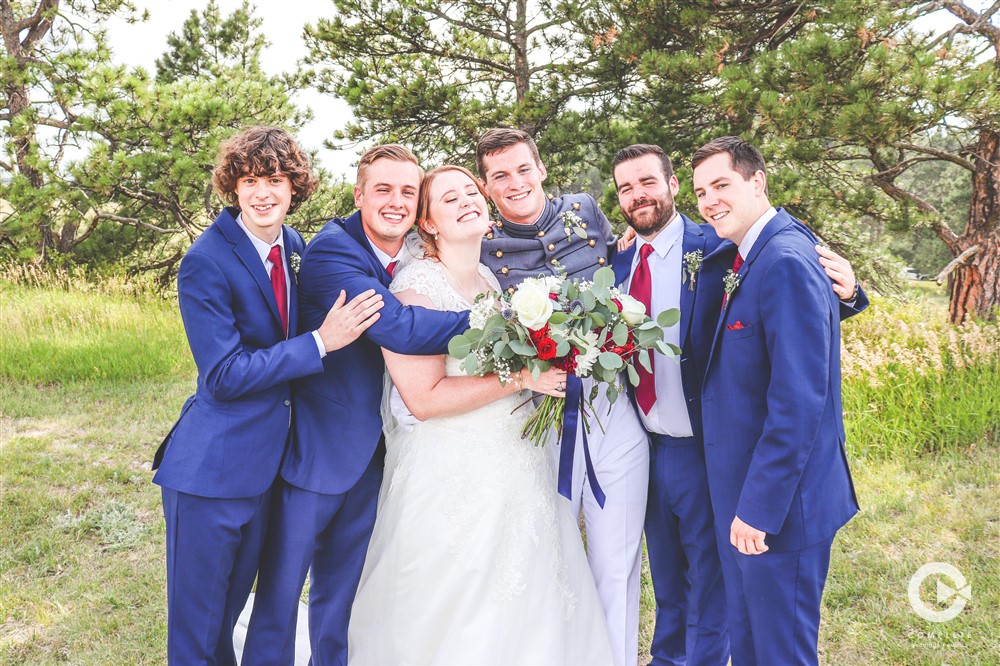 navy blue suits groomsmen with bride