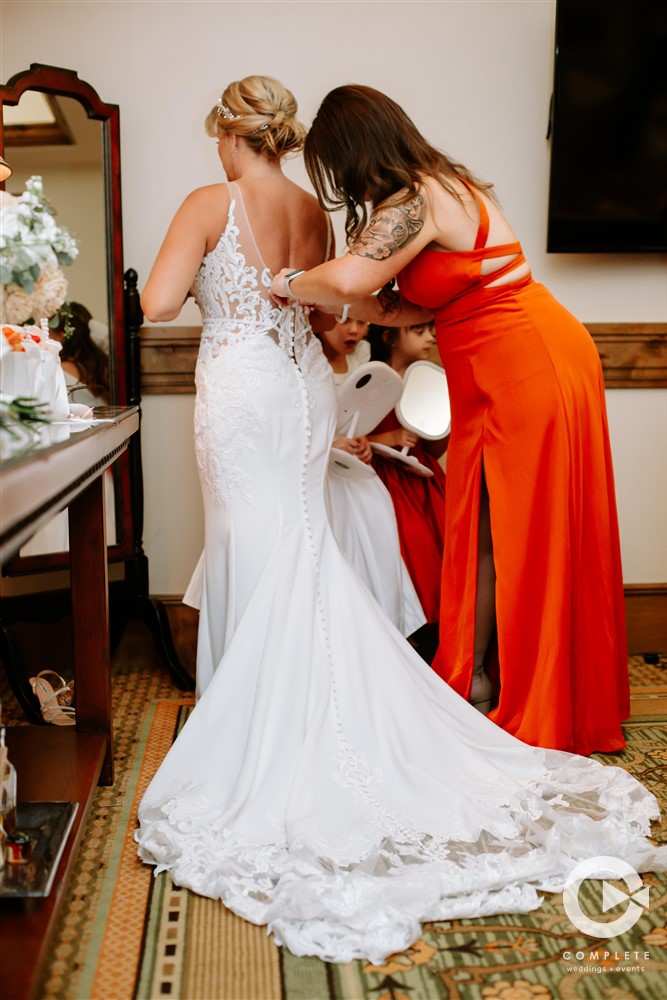 bride putting her dress
